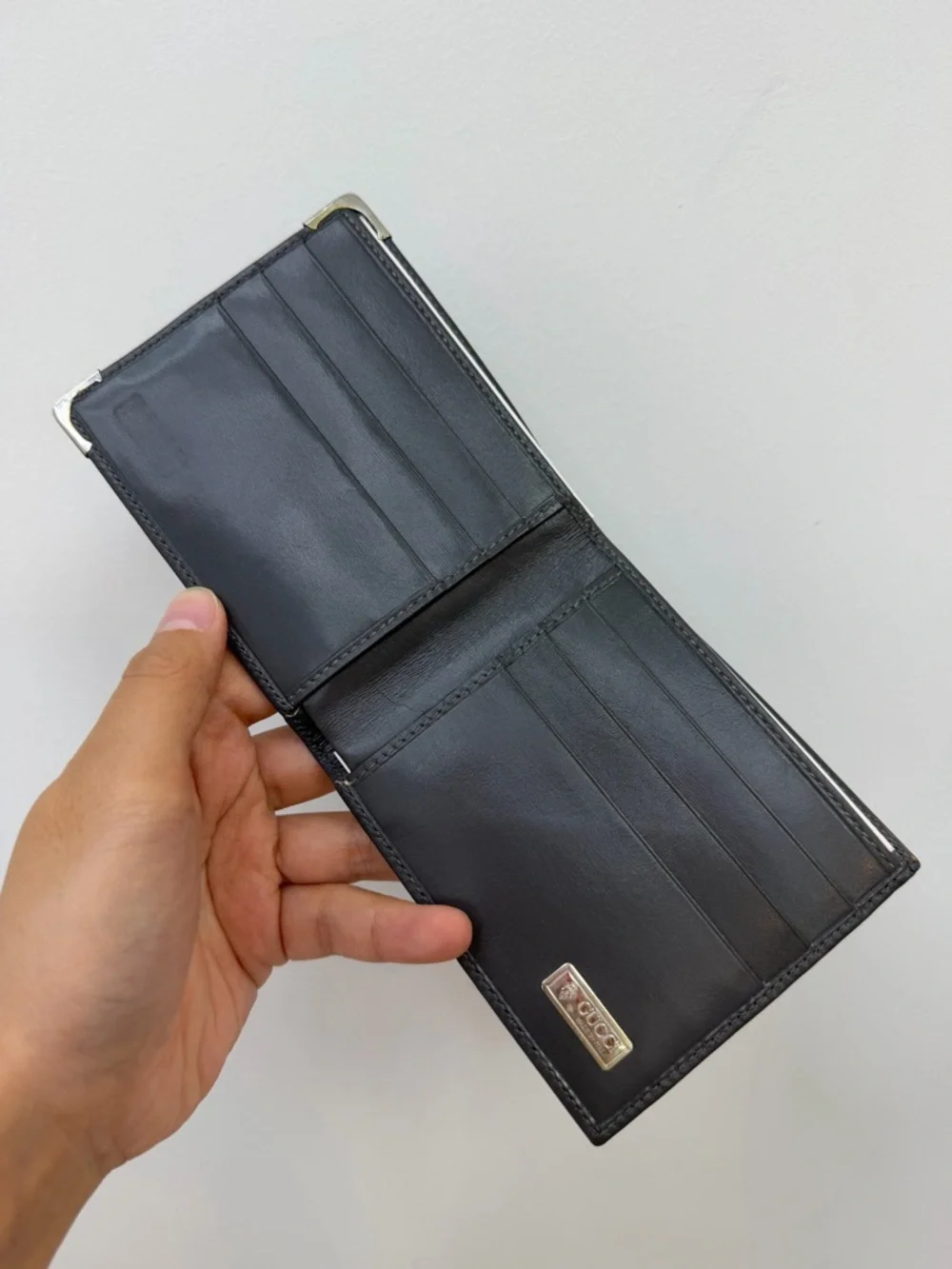 Gucci Classic Men's grey Leather Bifold Wallet with Corner Metal Accents